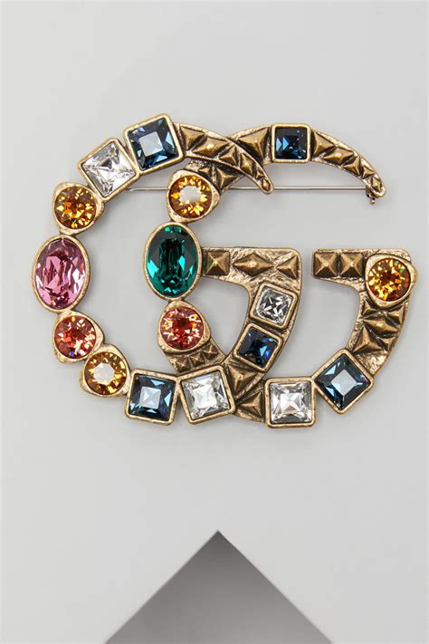 gucci brooches.